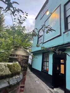 A Photo The Lanes clinic, wall and hedge to the right and the clinic building to the left